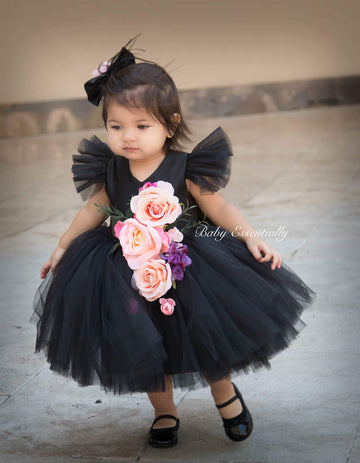 Black tulle tutu dress with big floral bouquet. Matching headpiece included