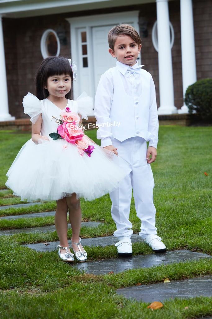 White tulle tutu dress with big floral bouquet. Matching headpiece included
