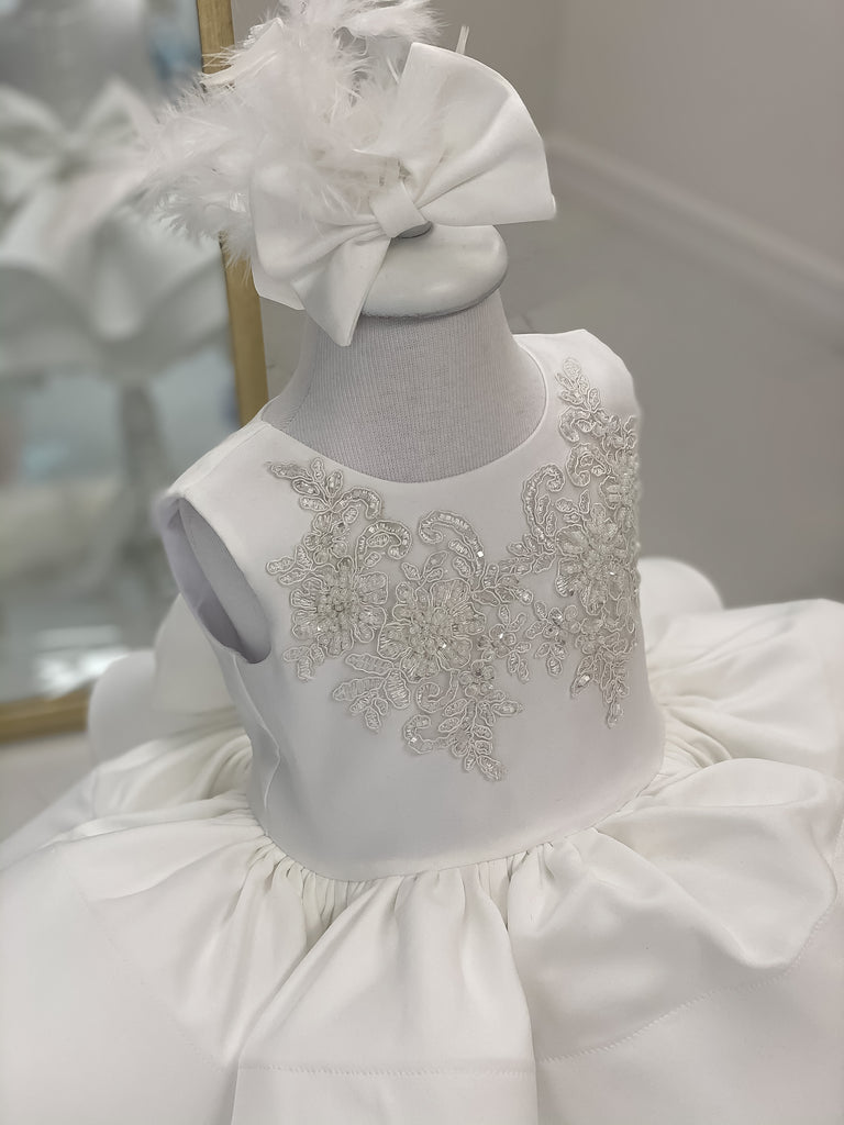 White sweet heart neck line mid length satin dress with double stair layers. Headpiece Included. Nodice has white Silver embroidery lace patch